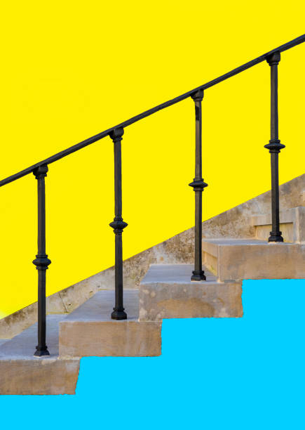 istock Stone steps staircase on a blue and yellow wall 1980719174