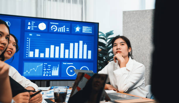 istock Group of business analyst team analyzing financial data report. Habiliment 1980752008