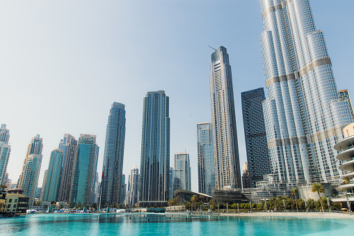 Low angle view of center district of Dubai city in United Arab Emirates with skyscrapers and old architecture buildings