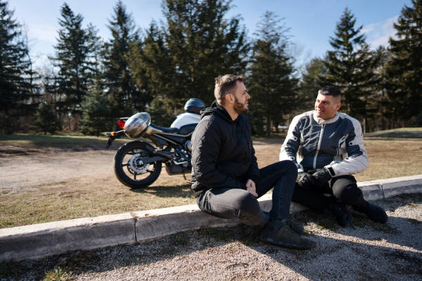 istock Men talking about motorbikes in the nature 1980764103