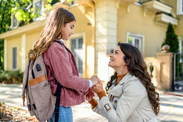 istock Mother taking her daughter to school 1980765161