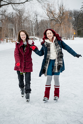 In the dance of winter, the trans teen and his mentor share a magical moment on the ice, their winter skating adventure weaving a tapestry of connection and joy in the frosty embrace of the season