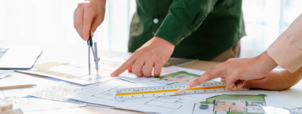 istock Professional engineer using divider to measure blueprint. Closeup. Delineation. 1980785022