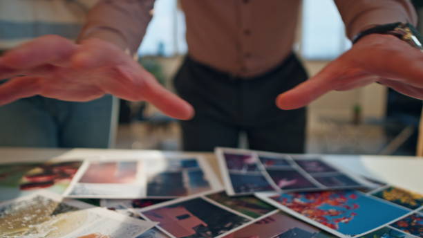 istock Creative team working together at conference hall putting design samples on desk 1980790054