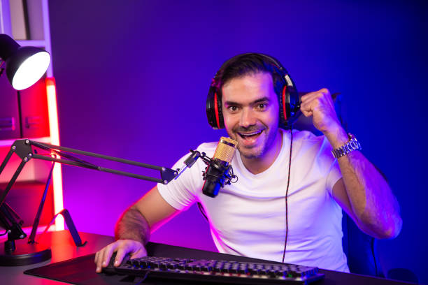istock Smart gaming streamer looking camera with pose using headset and mic. Surmise. 1980801813