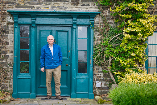 Retired gentleman wearing old, casual clothes.