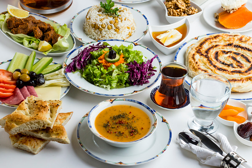 Traditional Turkish Ramadan,Iftar Menu with soup,salad and sliced Ramadan Bread.Large view