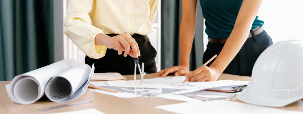 istock Professional architect used divider measure during draft blueprint. Delineation. 1980833061