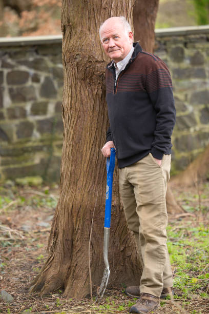 istock Elderly man in his gardening clothes 1980834123