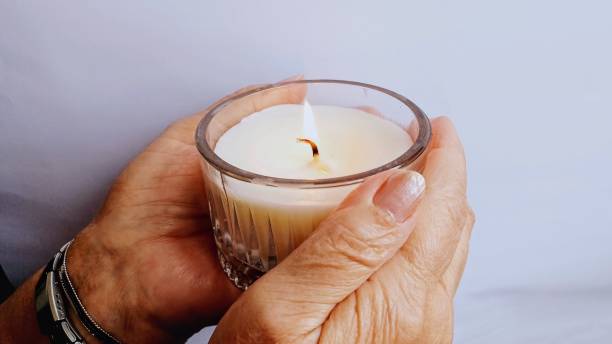 istock Candle in human hand 1980834645
