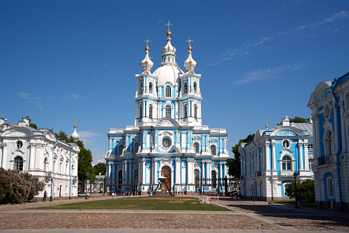 The domes of the Orthodox Church against the blue sky. Crosses on the domes of the church. Russia