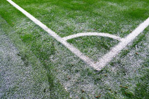 Corner markings of an artificial turf football field.