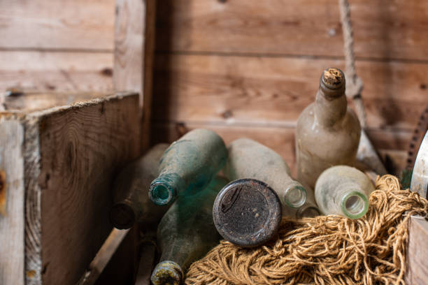 istock Old dusty glass flasks in a pile.. 1980869404