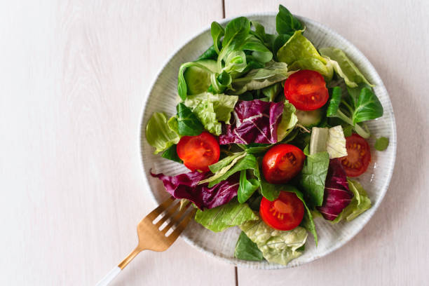 Fresh healthy salad. Plate of vegan salad. stock photo