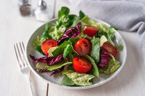 Fresh healthy salad. Plate of vegan salad.