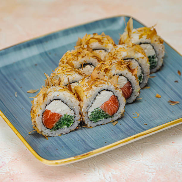 istock Blue Plate With Sushi Covered in Sauce 1980870523