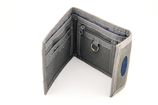 stylish men's gray denim wallet, a product made from natural denim fabric, isolated on a white background, close-up