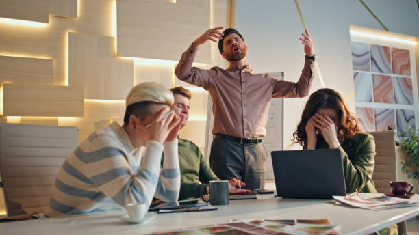 istock Stressed team disappointed work results in coworking place. Group business fail 1980942734