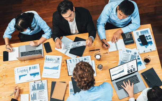 istock Panorama top view diverse analyst team analyzing financial data. Habiliment 1980952632