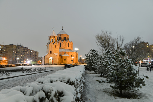 The Night scene with a snowy church