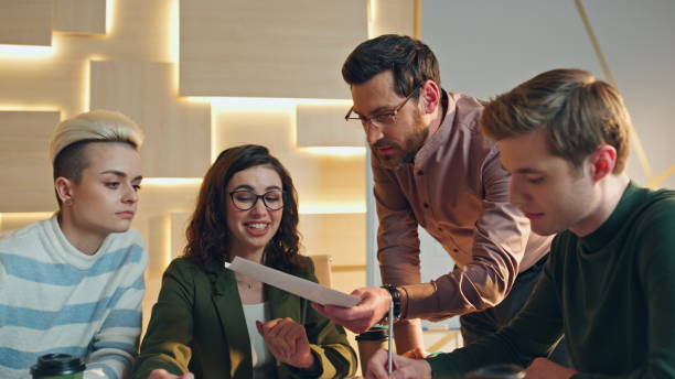 istock Group corporate employees discussing work project conference room. Team talking 1980962118