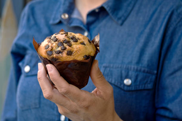 istock chocolate chip pancake held in a woman's hand 1980969025