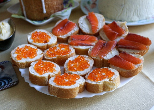 Snack Plate. Holiday Table. Salmon and Red Caviar Canapes . Sandwiches with Salmon and Red Caviar.