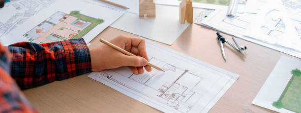 istock Closeup of architect engineer hand using ruler draw a blueprint. Delineation. 1981020001