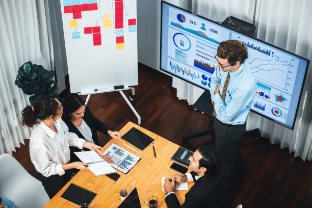 istock Wide top view diverse analyst team analyzing financial data. Habiliment 1981090957