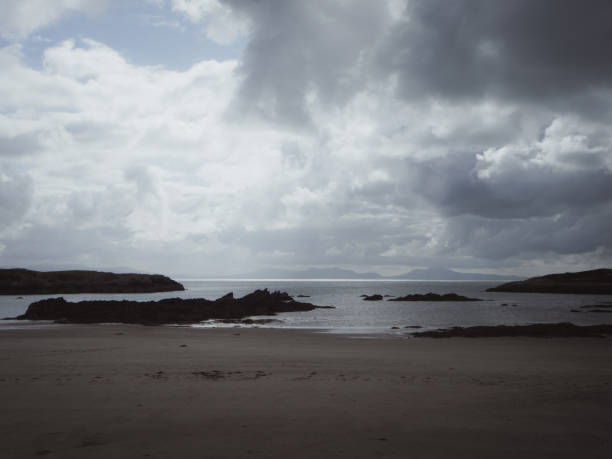 istock Moody clouds and beach in Rhoscolyn in Wales, UK 1981125435