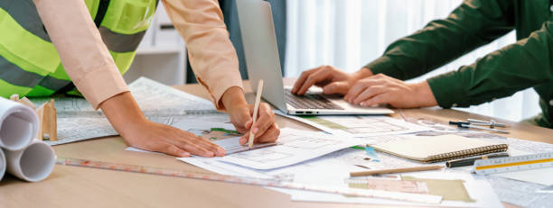 istock Professional engineer team discussion about house design. Closeup. Delineation. 1981127263