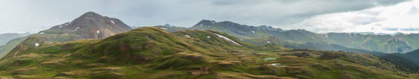 istock Summer mountain panorama in the tundra with sun rays 1981148063