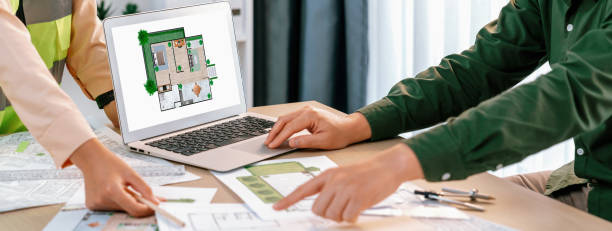 istock Architect show mistake point in blueprint while analysis in laptop. Delineation. 1981177041