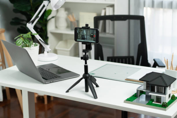 istock Equipment architecture recording by smartphone standing on white desk. Gusher. 1981187629