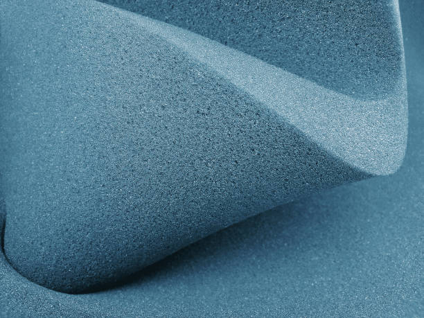 blue foam sheets rolled in a spiral thick dark blue sponge foam sheet with curved folds porous sponge stock pictures, royalty-free photos & images