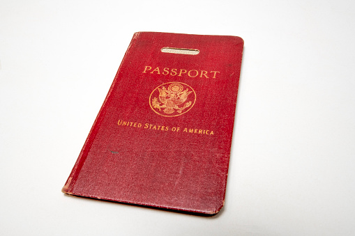 A empty pages of passport ready for stamping & Rubber stamp on top of the passport. Isolated on white with clipping path