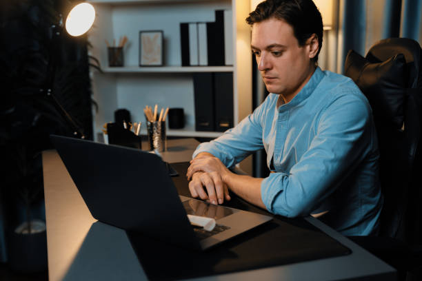 istock Businessman working on laptop for searching database market stock. Pecuniary. 1981216258