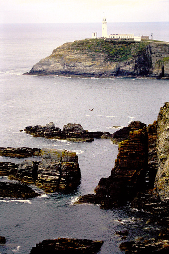 The shore of Cornwall in the UK in 1995, on old film stock.
