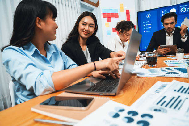 istock Group of business analyst team analyzing financial data report. Habiliment 1981239639