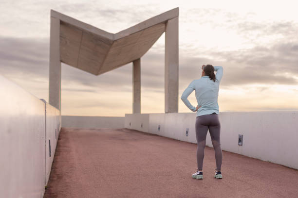 istock Reflecting the Effort: Athlete Wipes Off Sweat After Intense Exertion 1981246985