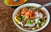 Chicken Soto or Beef Soto Sokaraja, Central Java, Indonesia. A typical Indonesian food in the form of a type of chicken or beef soup with a yellowish sauce.