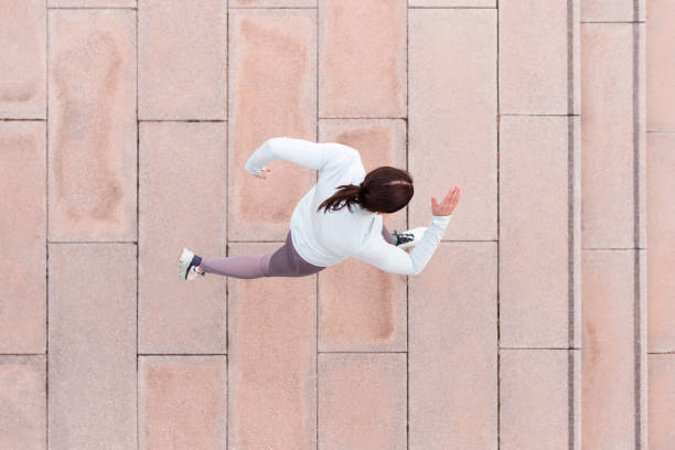 Aerial Perspective of Female Sprinter Without Casting Shadow