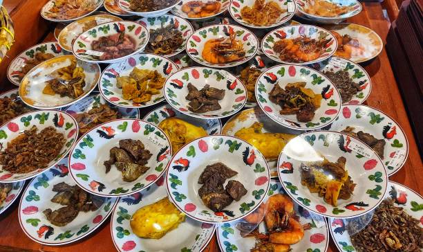 istock Various Indonesian dishes such as fish, shrimp, chicken, lungs served on layered plates. 1981377436