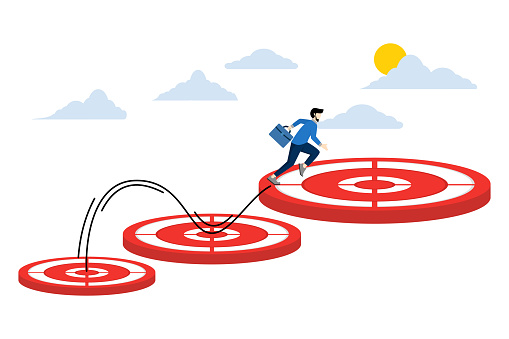 Concept of aspiration and motivation to achieve bigger business targets, progress in career or business growth concept, businessman jumping towards bigger and higher target arrow.