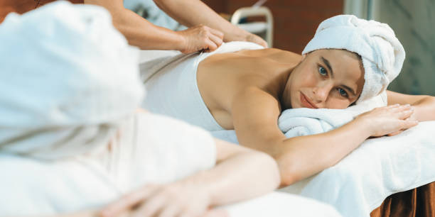 istock Two beautiful young woman having back massage. Front view. Tranquility. 1981477356