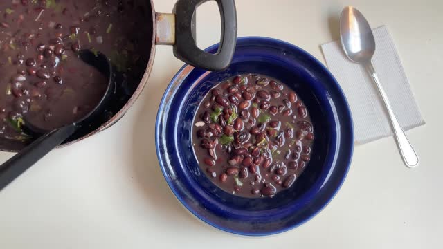 Serving black beans soup at home