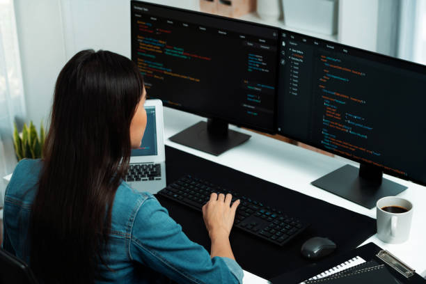 istock Young Asian in IT creating with typing online information on pc. Stratagem. 1981533995