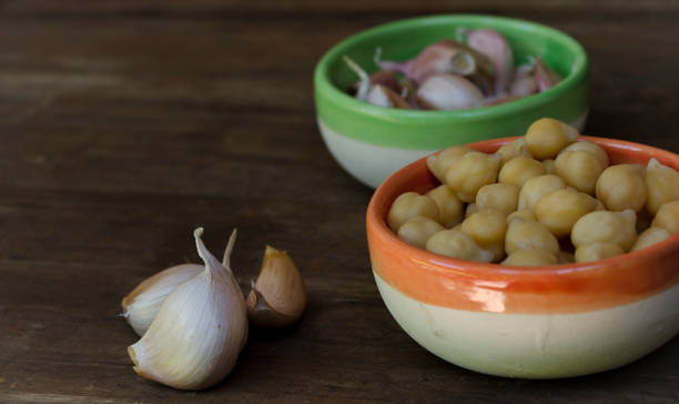 istock chickpeas with garlic in ceramic bowls for hummus 1981546531