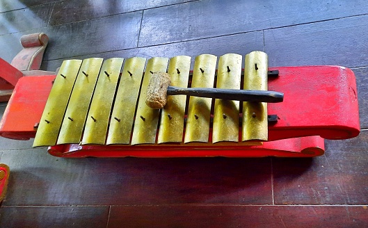 Saron, a gamelan musical instrument in the form of metal blades placed on a hollow wooden container. Javanese gamelan musical instrument. Traditional musical instruments from Indonesia. Cultures.