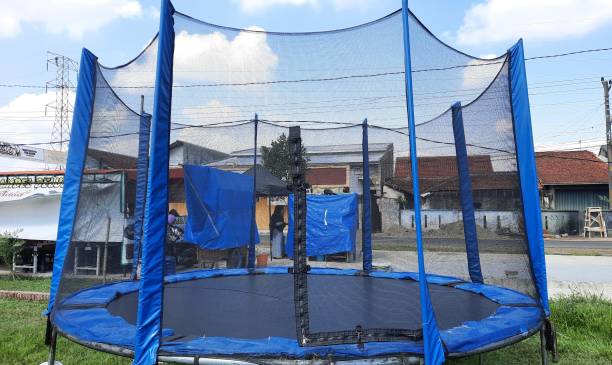 istock Mini round trampoline with a net that surrounds it as a safety 1981589217